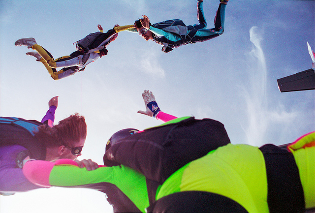 People jumping out of an airplane.